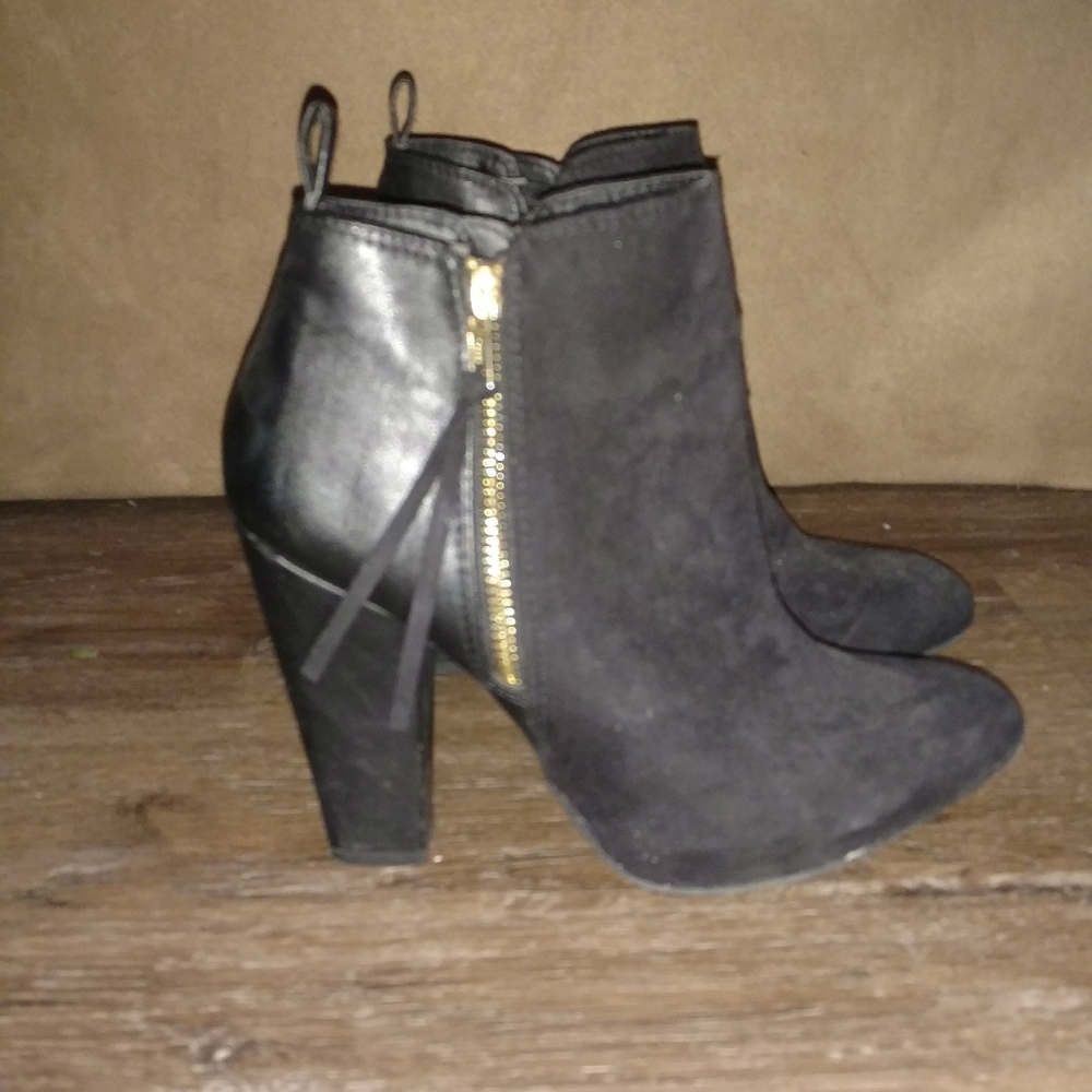 Black booties with gold zippers
